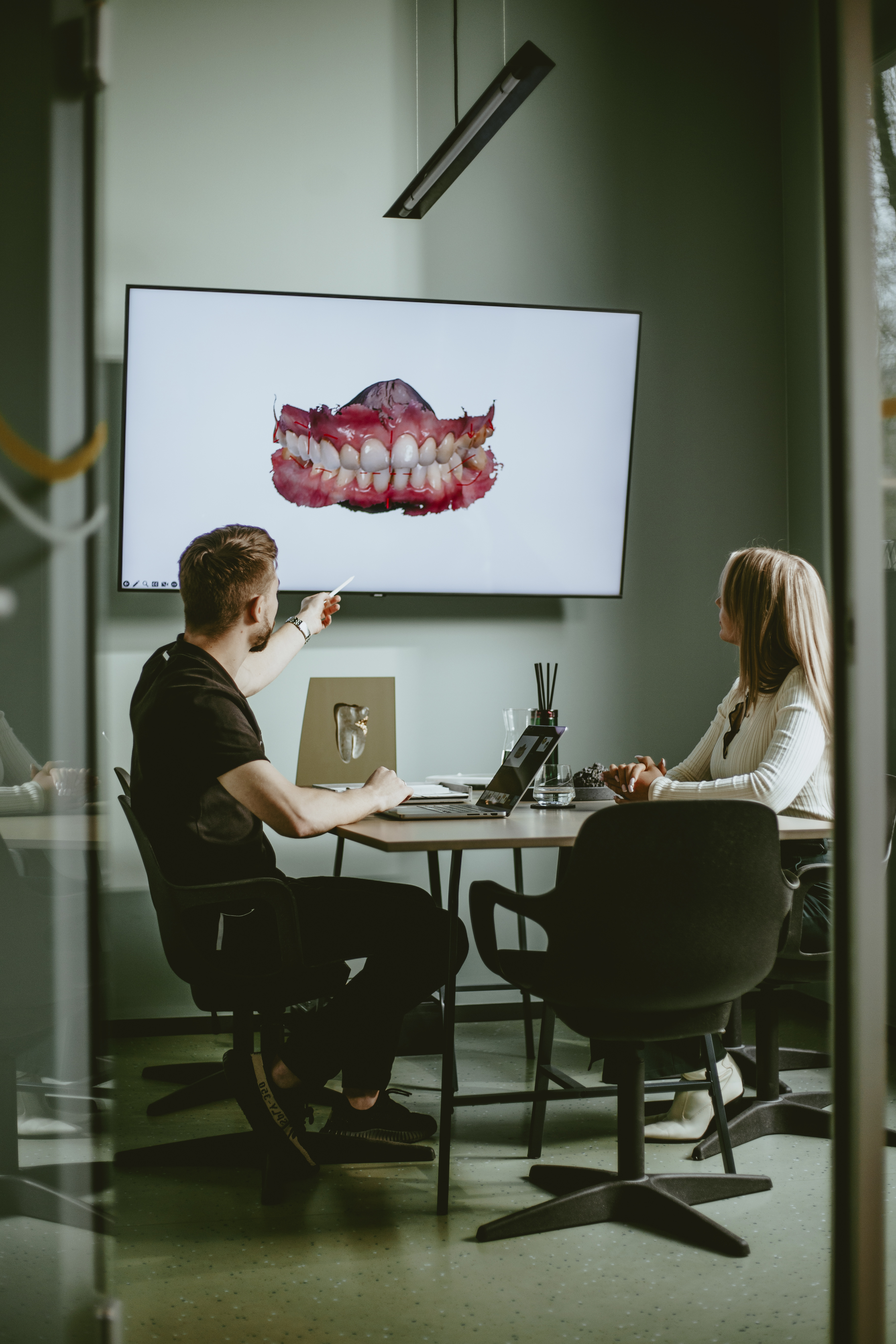 Doctor presenting 3D Digital Smile Design to guest at LAVA Dental Studio